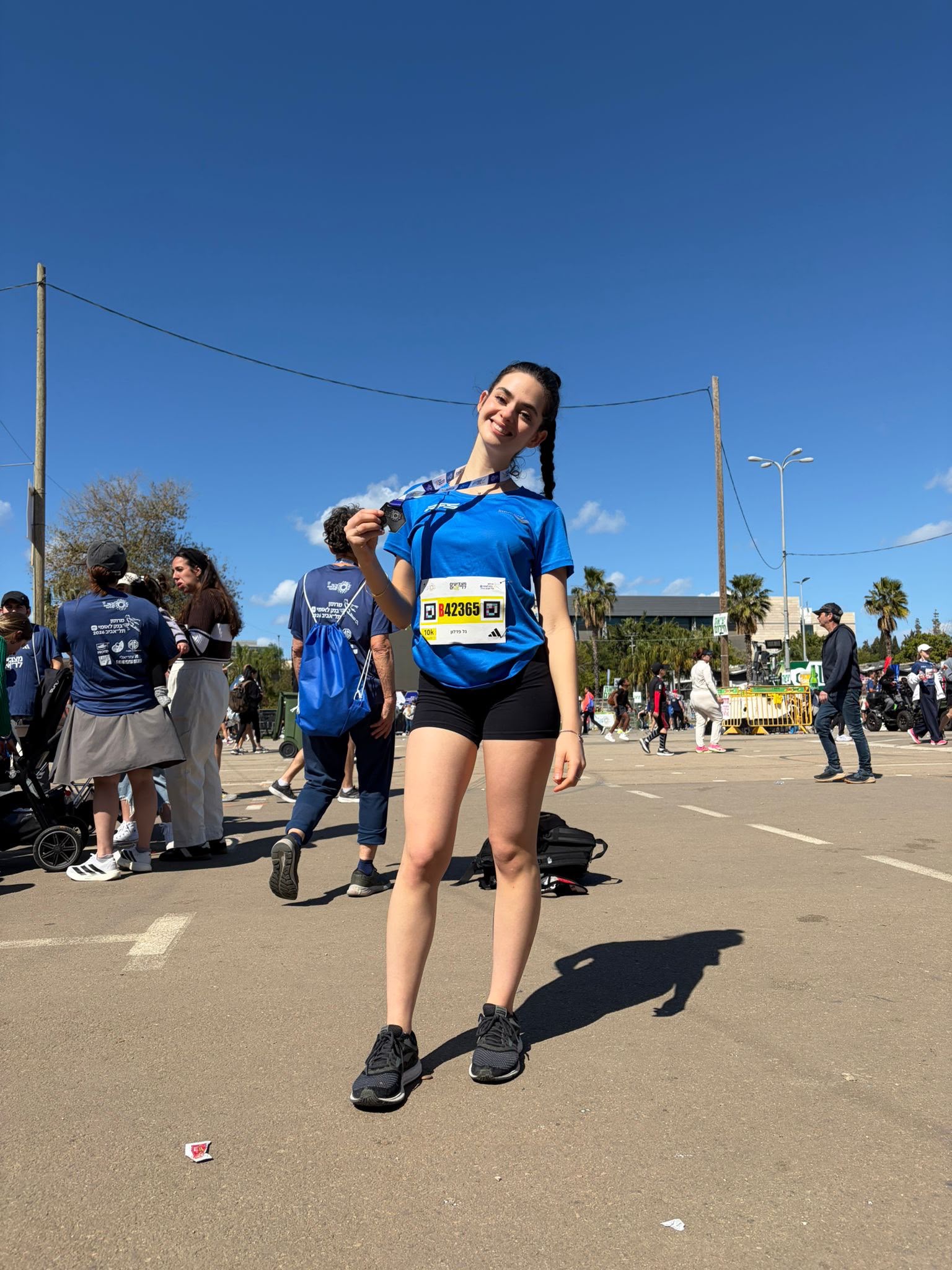 10K finisher with her medal